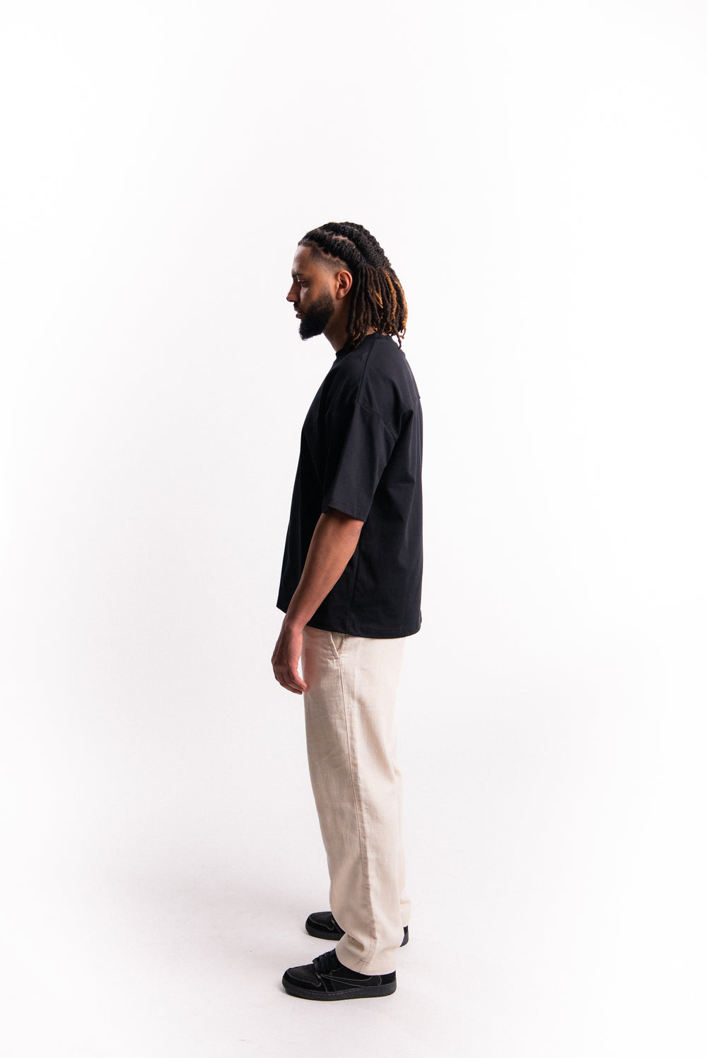 SILNTPLAY Embossed Tee in Obsidian, boxy structured fit, back view