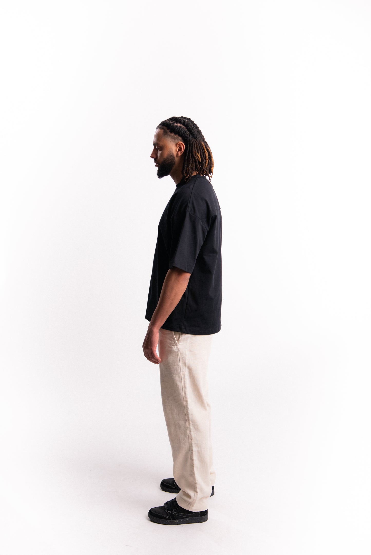 SILNTPLAY Embossed Tee in Obsidian, boxy structured fit, back view