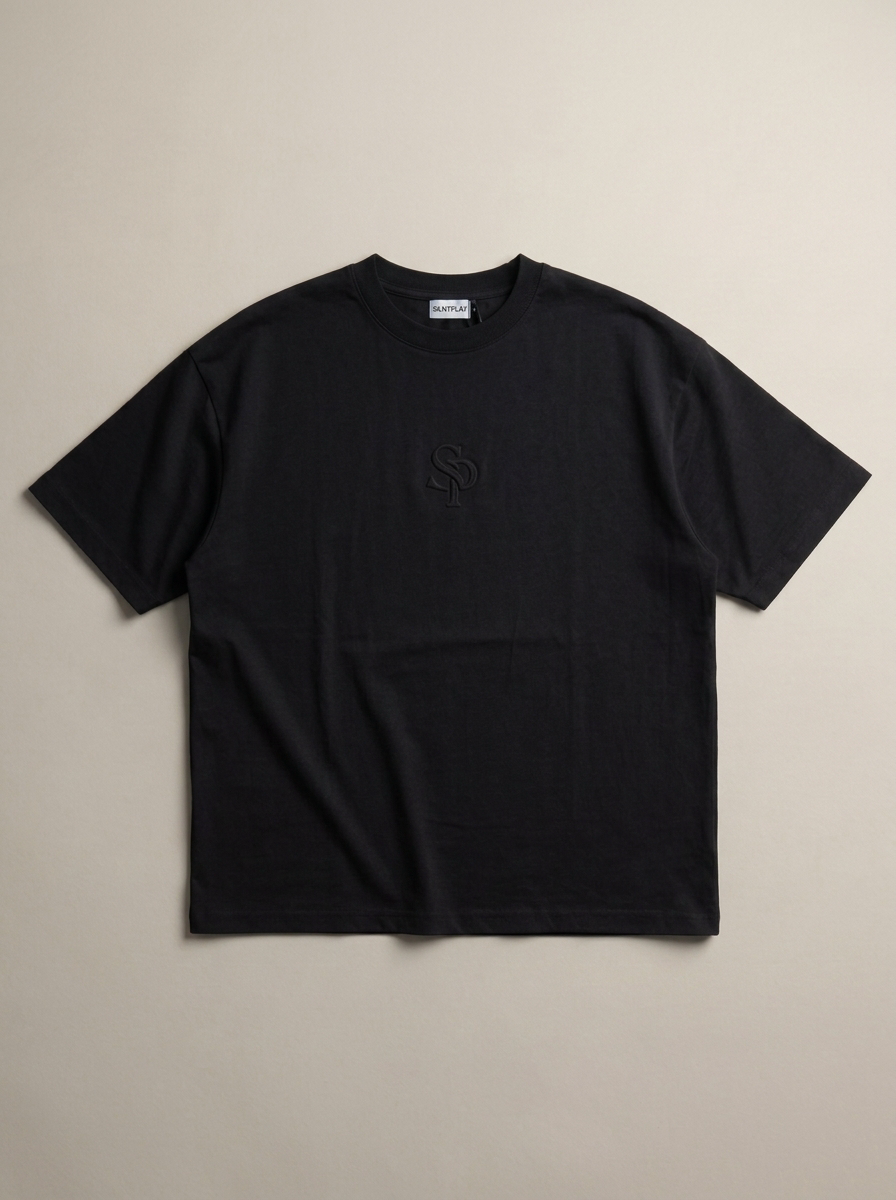 The SILNTPLAY Embossed Tee in Obsidian, front flatlay
